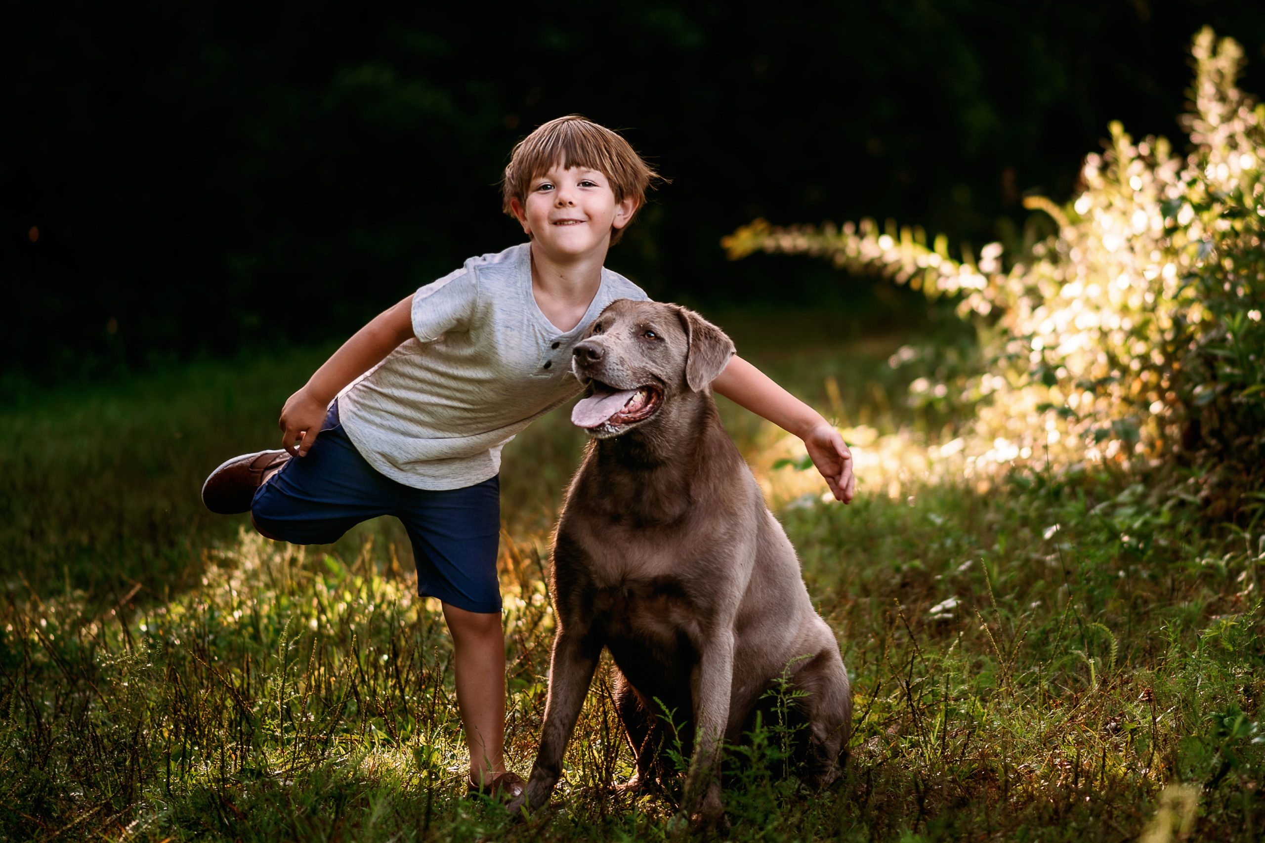 Child and dog in the summer sun.